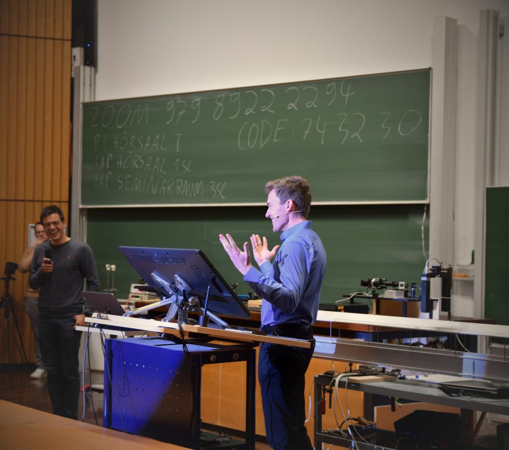 Grant Sanderson with the organisers of the Physics Colloquium