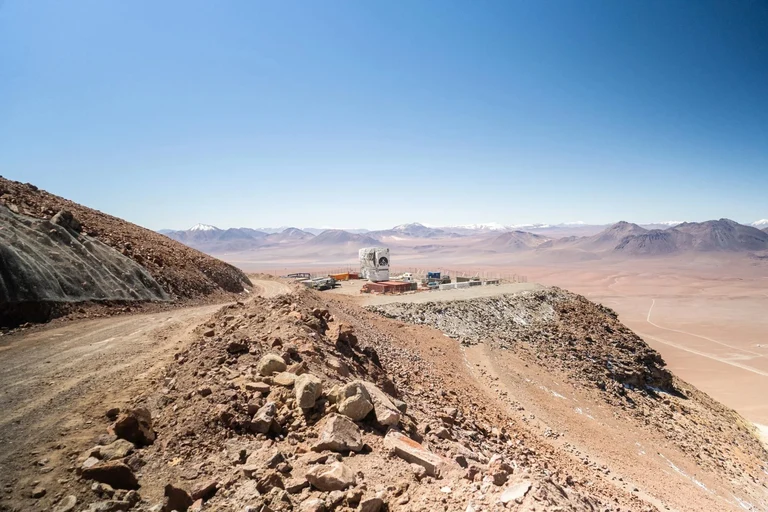 The Fred-Young-Submillimetre Telescope on a mountain top in Chile.